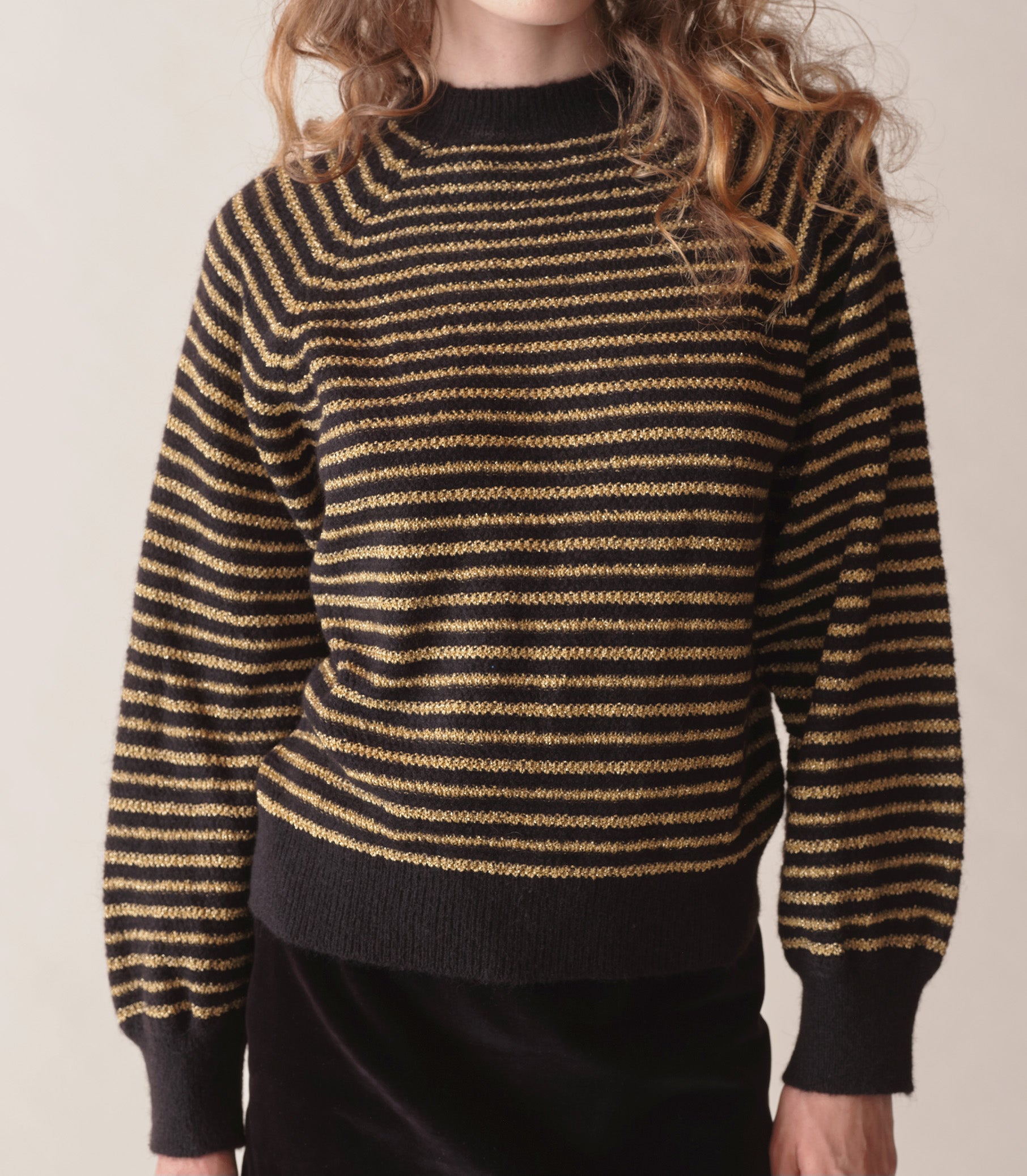 Black and gold sweater on sale