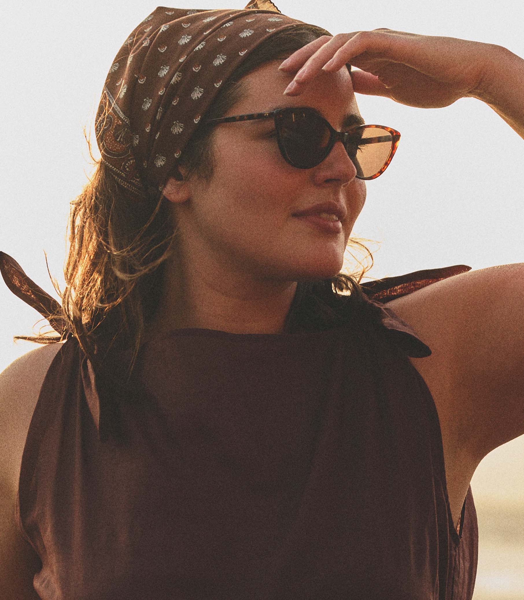Woman wearing sunglasses and a headscarf with a blurred background 1
