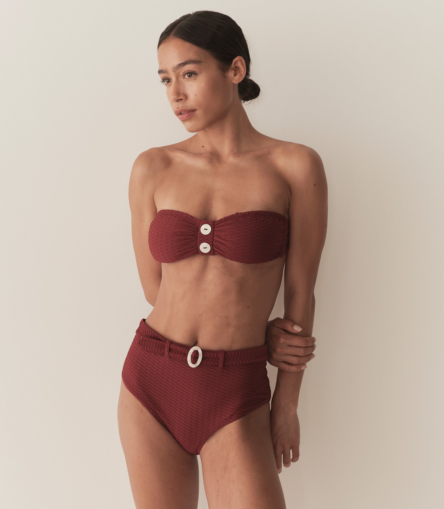 Zahara wears a deep burgundy matching bikini set.